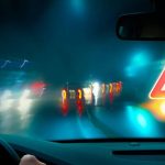 Blurry vision while driving at night with a visible warning sign; degenerative myopia risk